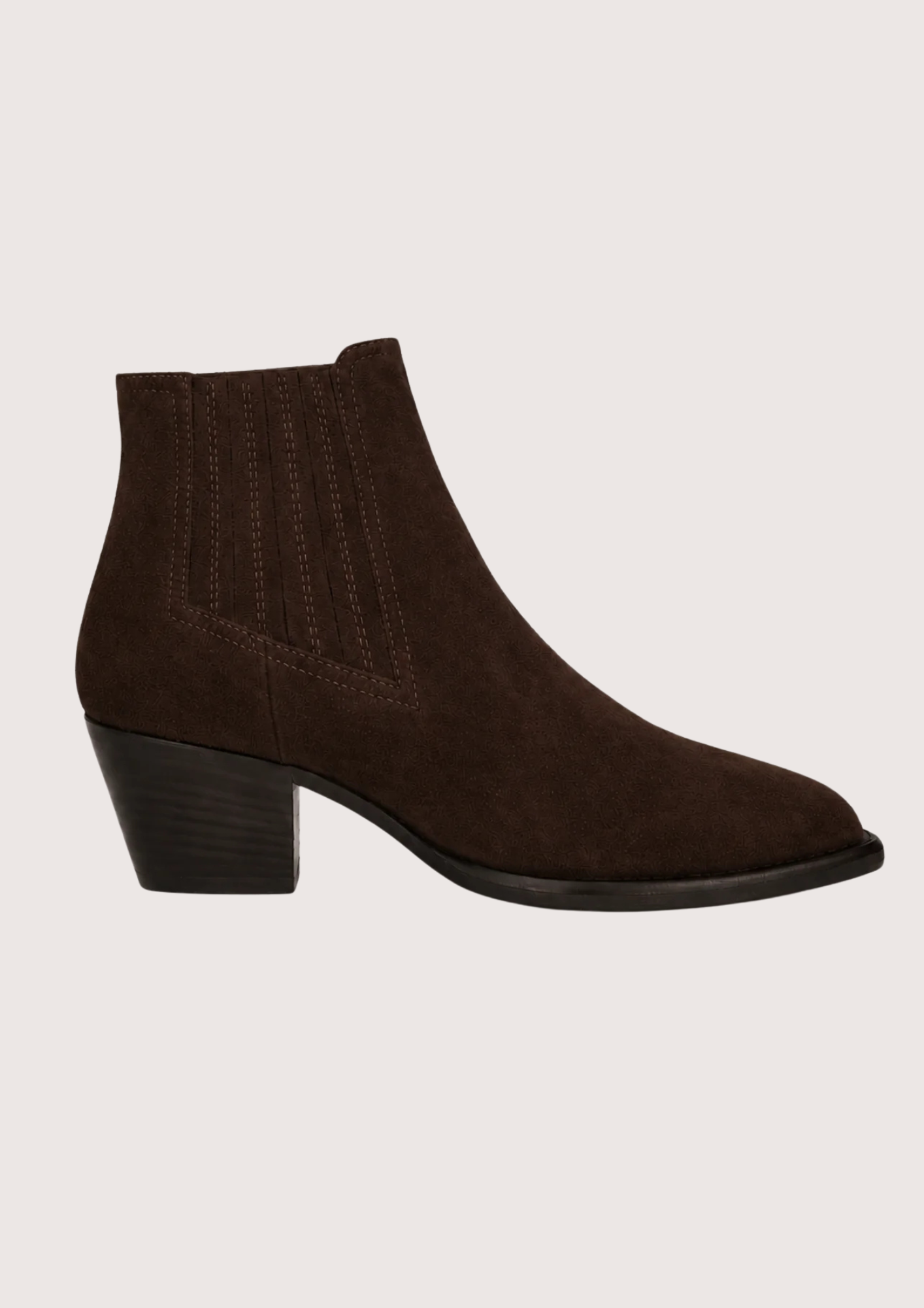 A pair of dark brown suede ankle boots with ribbed elastic side panels and low block heels, displayed against a solid light beige background.
