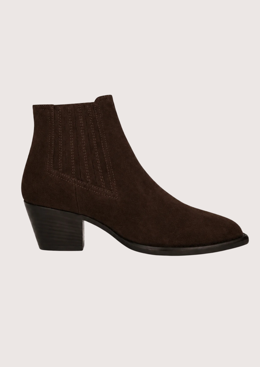 A pair of dark brown suede ankle boots with ribbed elastic side panels and low block heels, displayed against a solid light beige background.