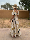Ivory dress with black and green pattern on 