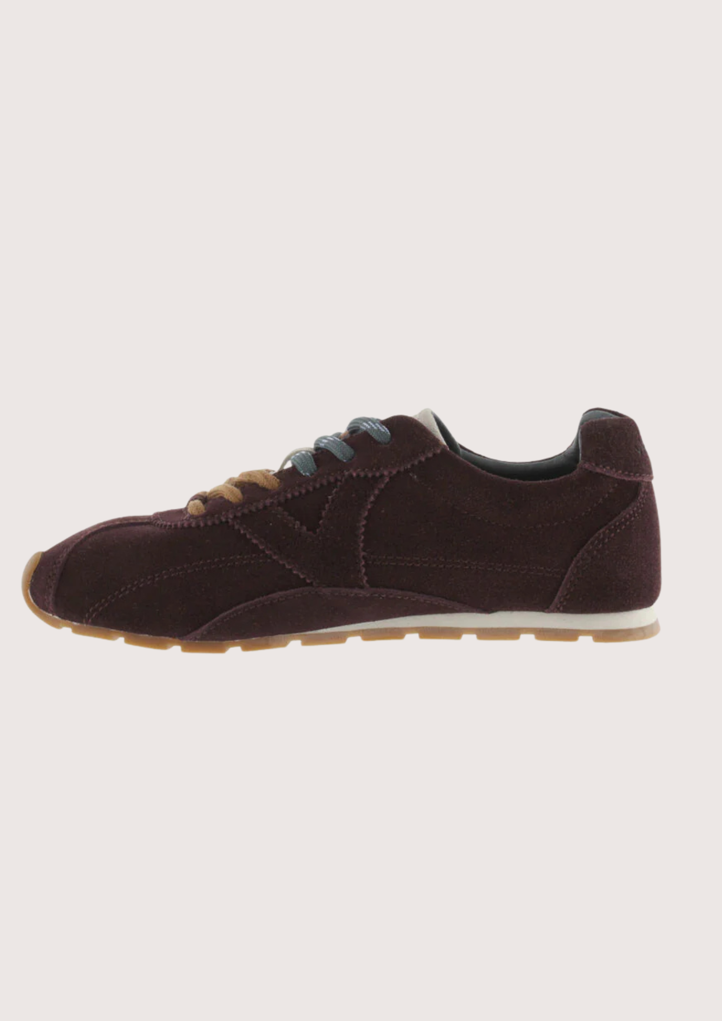 Brown suede sneaker with beige sole on a white background