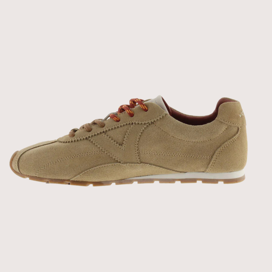 Brown suede shoe on a white background