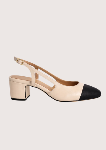 cream heeled shoe with a slingback on a white background.