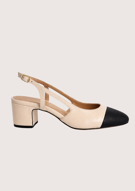cream heeled shoe with a slingback on a white background.