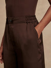 wide leg elasticated waist chocolate brown sateen trousers close up of waist