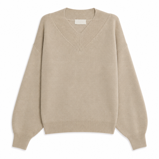 A light beige knit sweater with a V-neck and long balloon sleeves, shown flat against a plain white background.