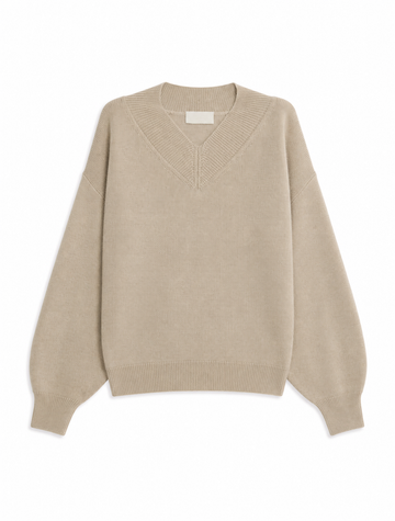 A light beige knit sweater with a V-neck and long balloon sleeves, shown flat against a plain white background.