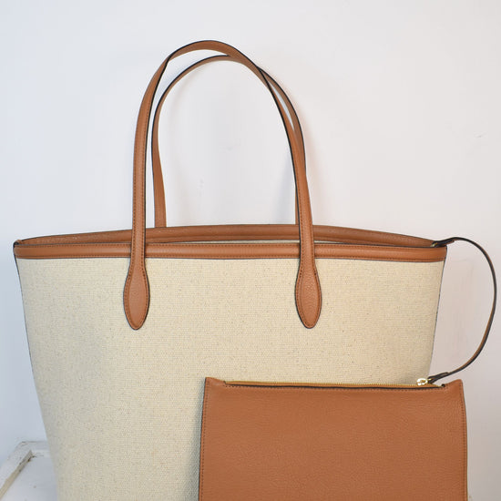 Neutral canvas totoe with tan leather trim