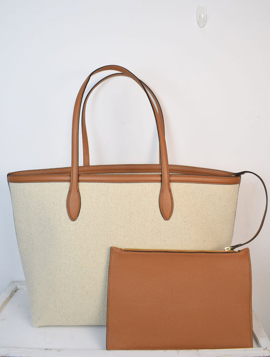 Neutral canvas totoe with tan leather trim