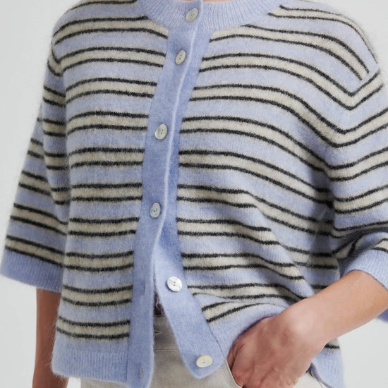 Person wearing a light blue cardigan with black and beige striped pattern on a white background from Second Female