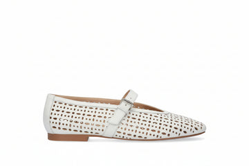 white flat shoe with cutouts 