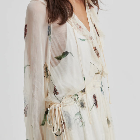 Woman wearing a floral kimono-style garment on a white background from Second Female