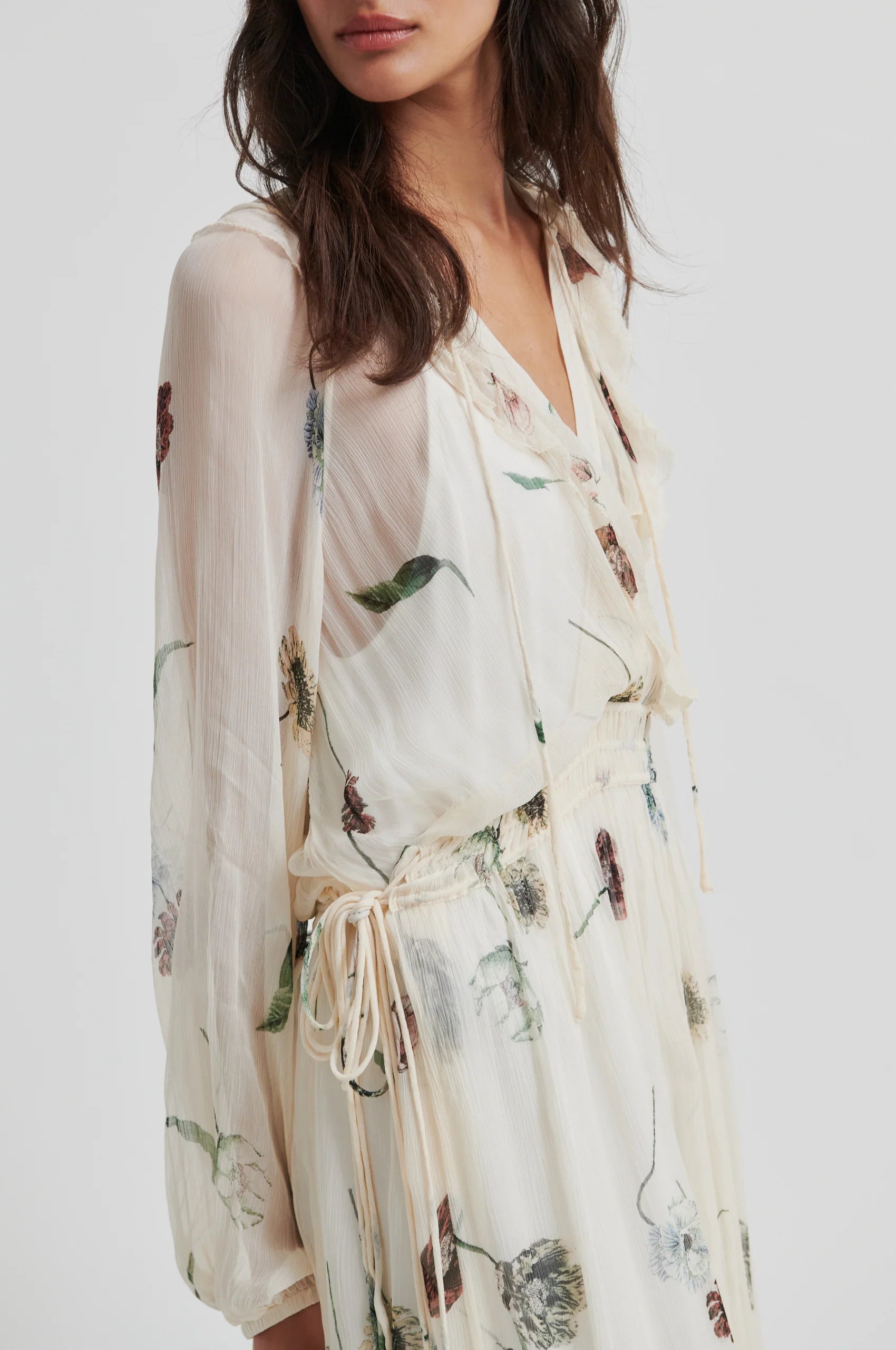 Woman wearing a floral kimono-style garment on a white background from Second Female