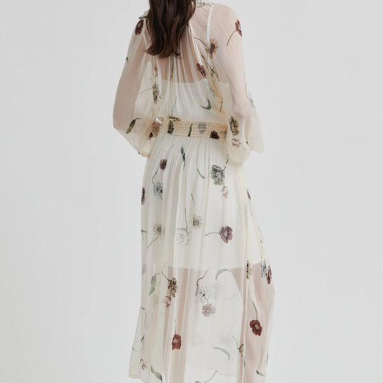 Woman wearing a floral dress on a white background from Second Female