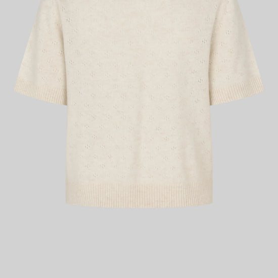 Beige sweater on a light gray background