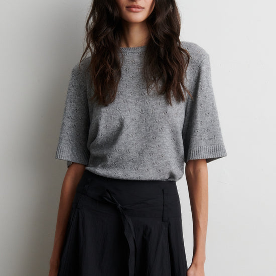 Round neck short sleeve cashmere blend jumper from Second Female worn with black skirt