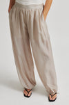Beige wide-leg pants worn by a person on a white background from Second Female