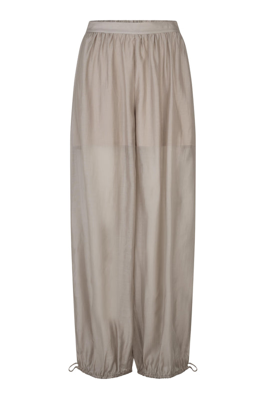 Beige wide-leg pants on a white background from second female