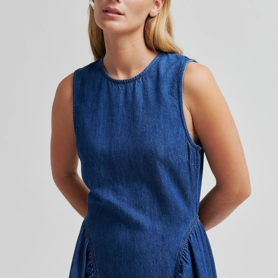 Blue denim dress by second female on a woman close up