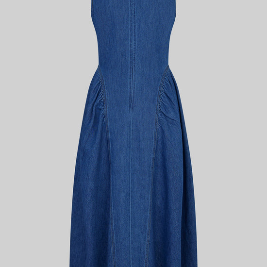 Blue denim dress by second female on a white background rear view