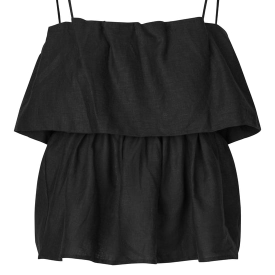 Black layered top with thin straps on a white background from second female