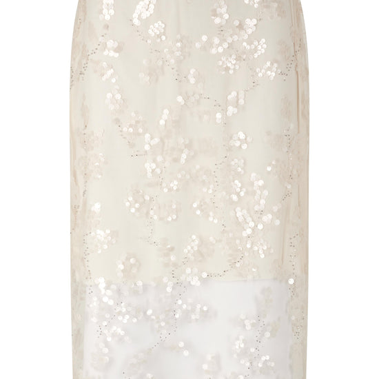 White sequin skirt on a white background from second female