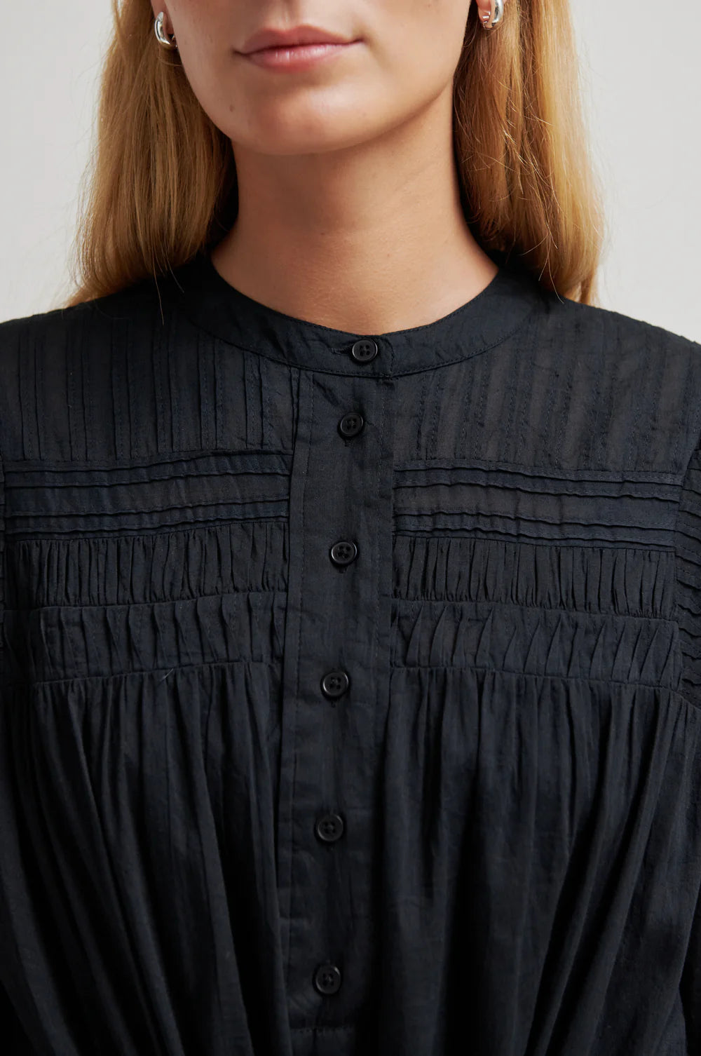 close up of the black dress on a model