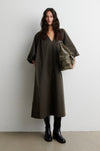 Model wearing dark khaki V neck dress from Second Female