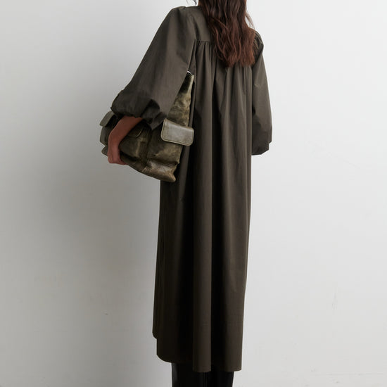 Rear view of woman wearing dark khaki dress from Second Female