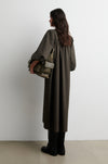 Rear view of woman wearing dark khaki dress from Second Female