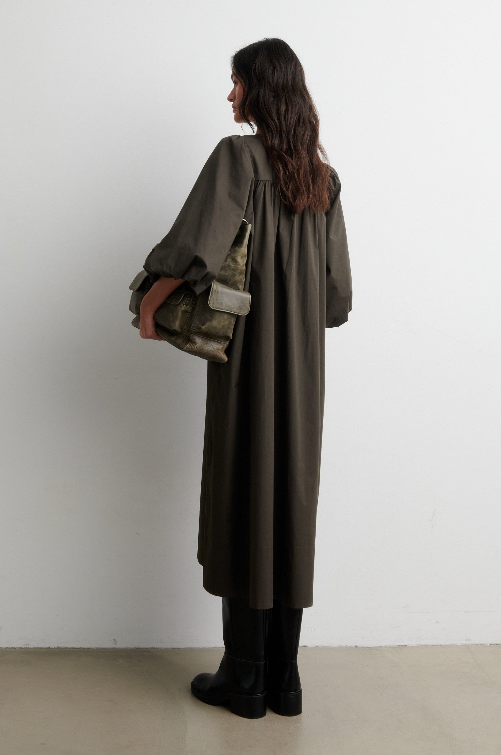 Rear view of woman wearing dark khaki dress from Second Female