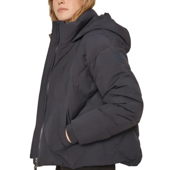 navy blue down jacket with diamond stitch design, zipped away hood and side pockets  model shot 