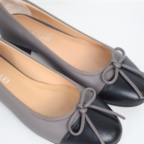 Taupe ballet pump with black toe and bow detail