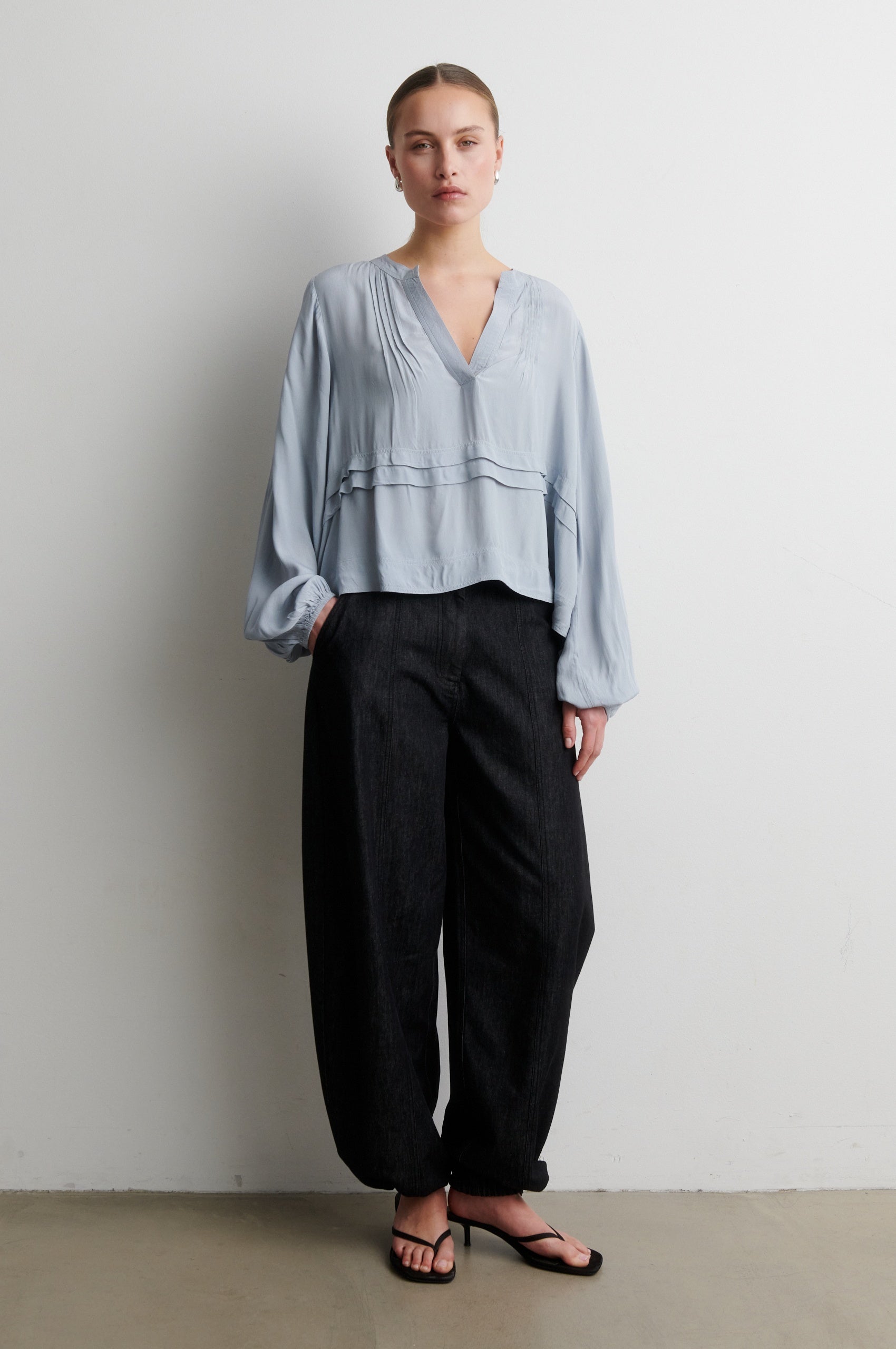 Pale grey shirt worn with black balloon trousers from Second Female