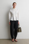 White shirt worn with black trousers from Second Female