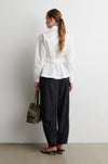 Rear iew of white shirt with black trousers from Second Female