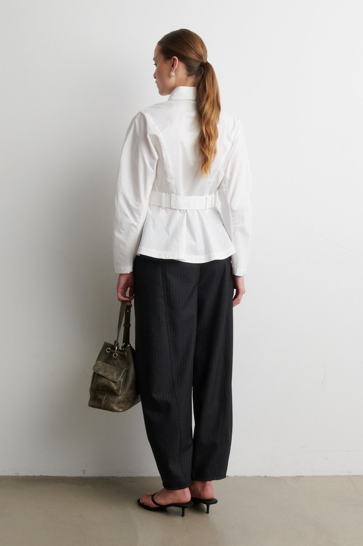 Rear iew of white shirt with black trousers from Second Female