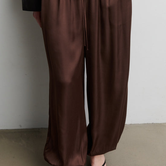 Brown satin trousers worn by a person against a neutral background from Second Female