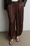 Brown satin trousers worn by a person against a neutral background from Second Female
