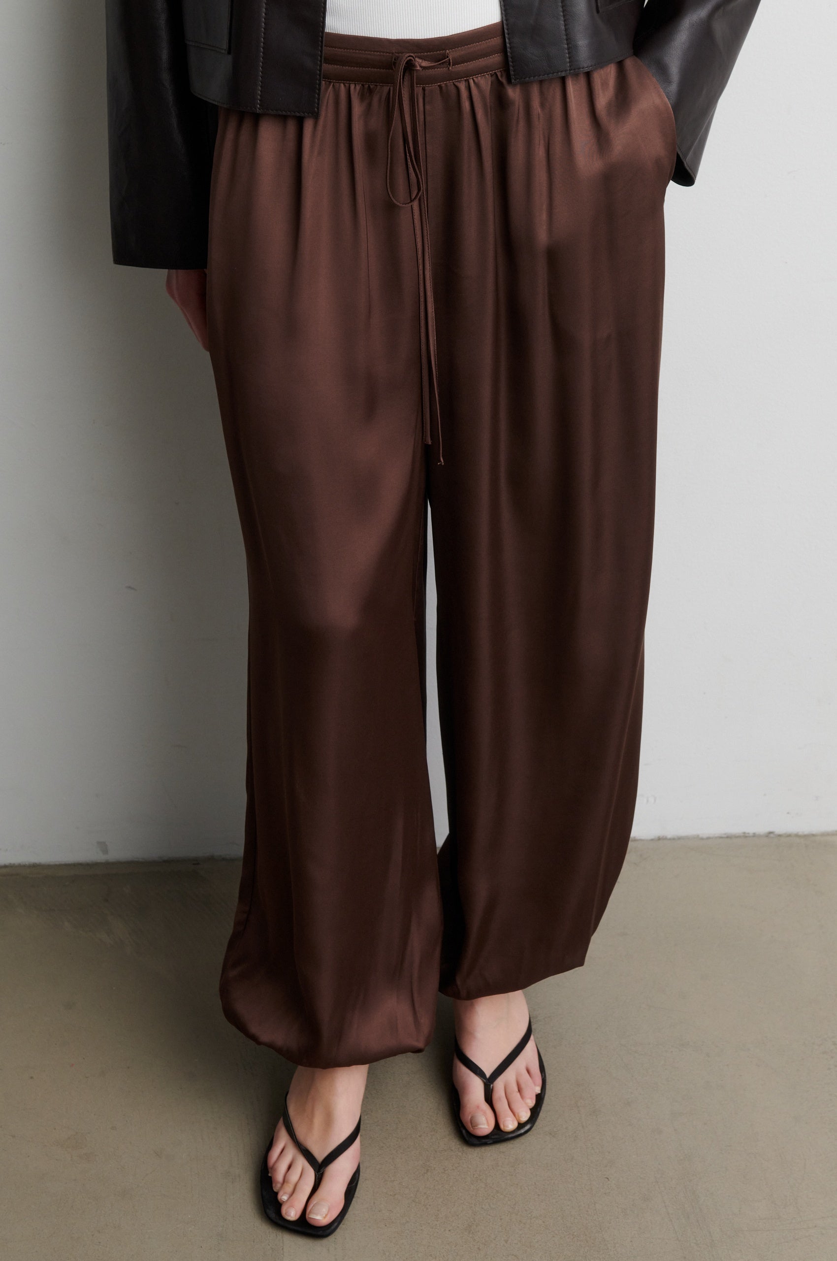 Brown satin trousers worn by a person against a neutral background from Second Female