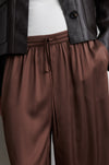 Close up detail of brown satin trousers from Second Female