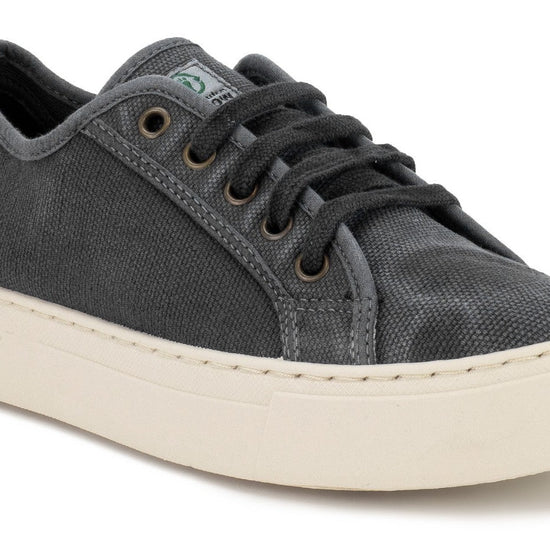 Grey washed out plimsole with laces and thick rubber sole