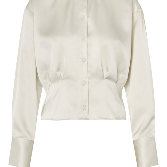 Cream blouse on a white background