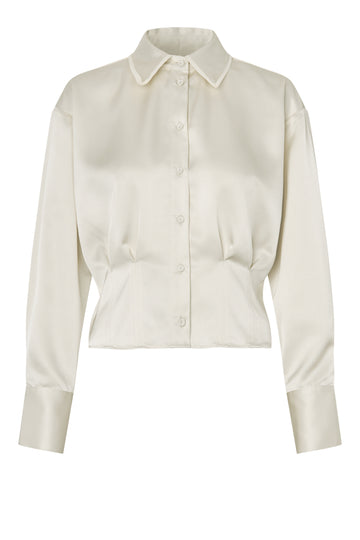 Cream blouse on a white background