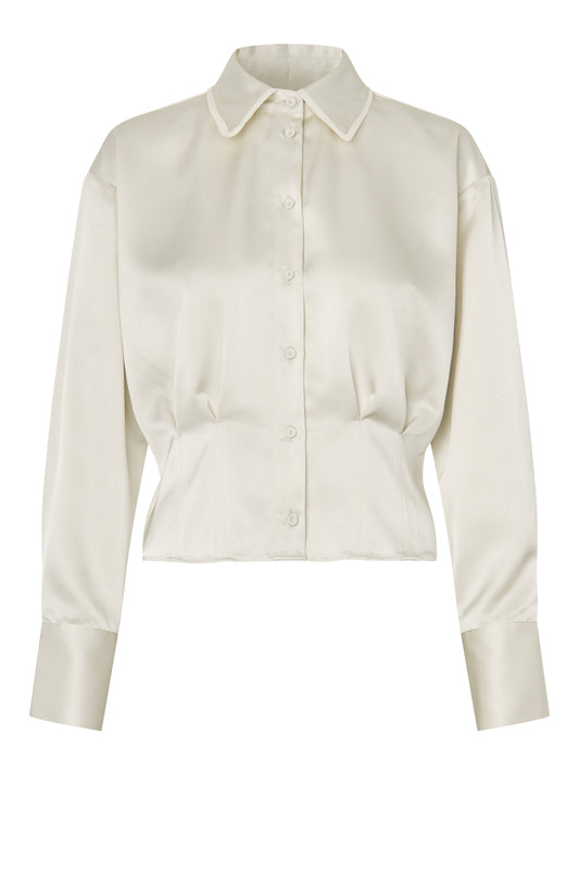 Cream blouse on a white background