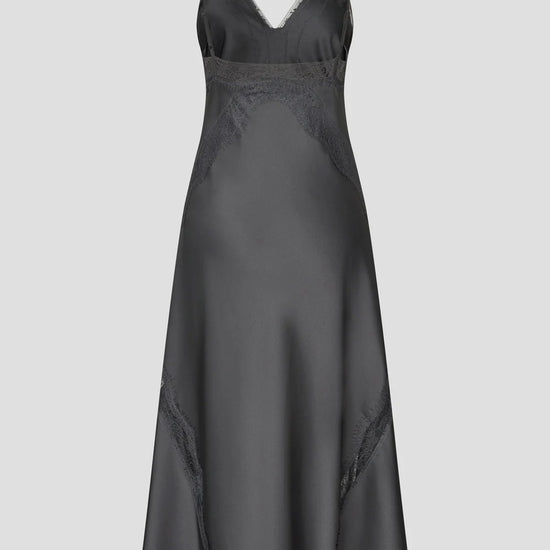 A dark gray satin slip dress with thin spaghetti straps and subtle lace detailing, shown against a solid light gray background.