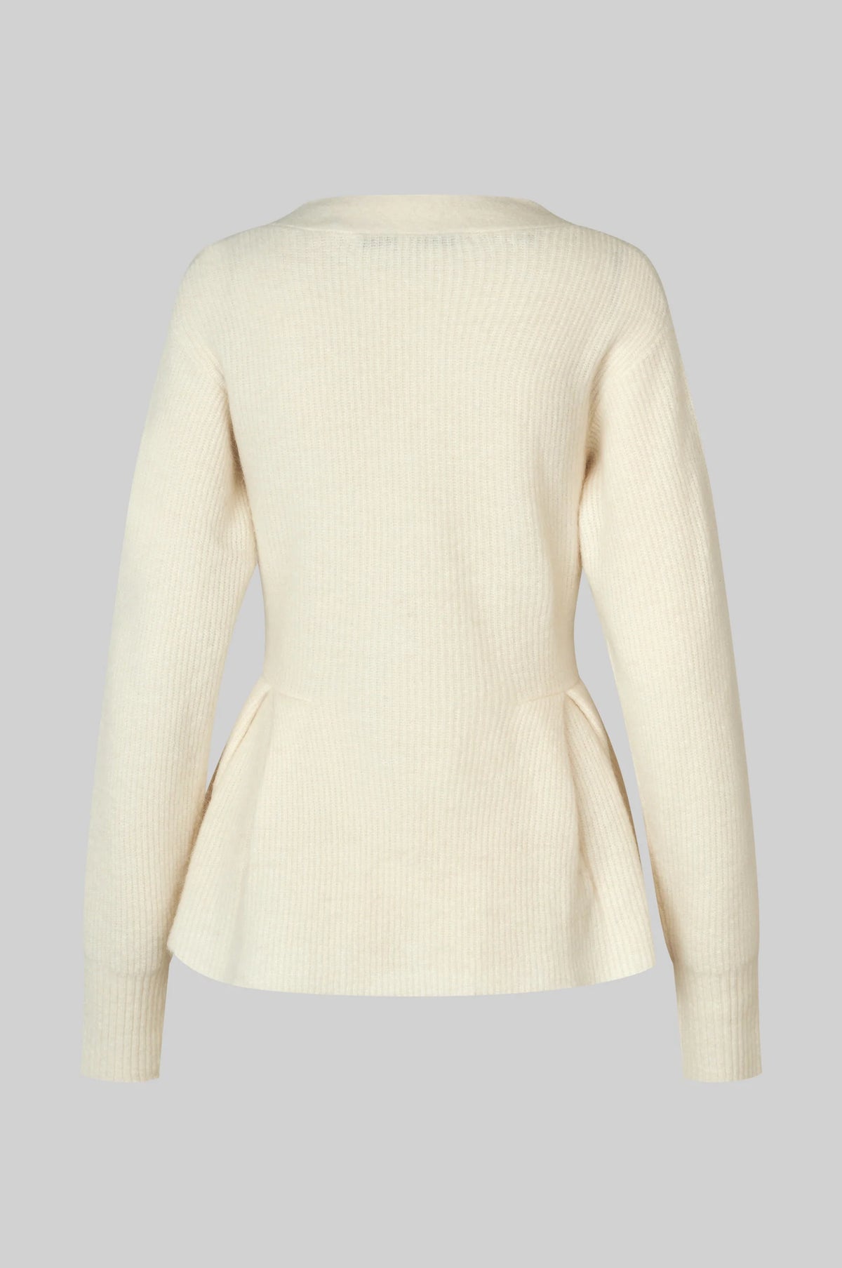 A cream-colored ribbed knit cardigan sweater with long sleeves and a peplum waist, shown from the back on a solid gray background.