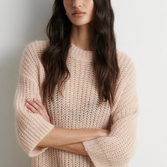 Shortr sleeve knit worn with sequin skirt
