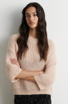 Shortr sleeve knit worn with sequin skirt
