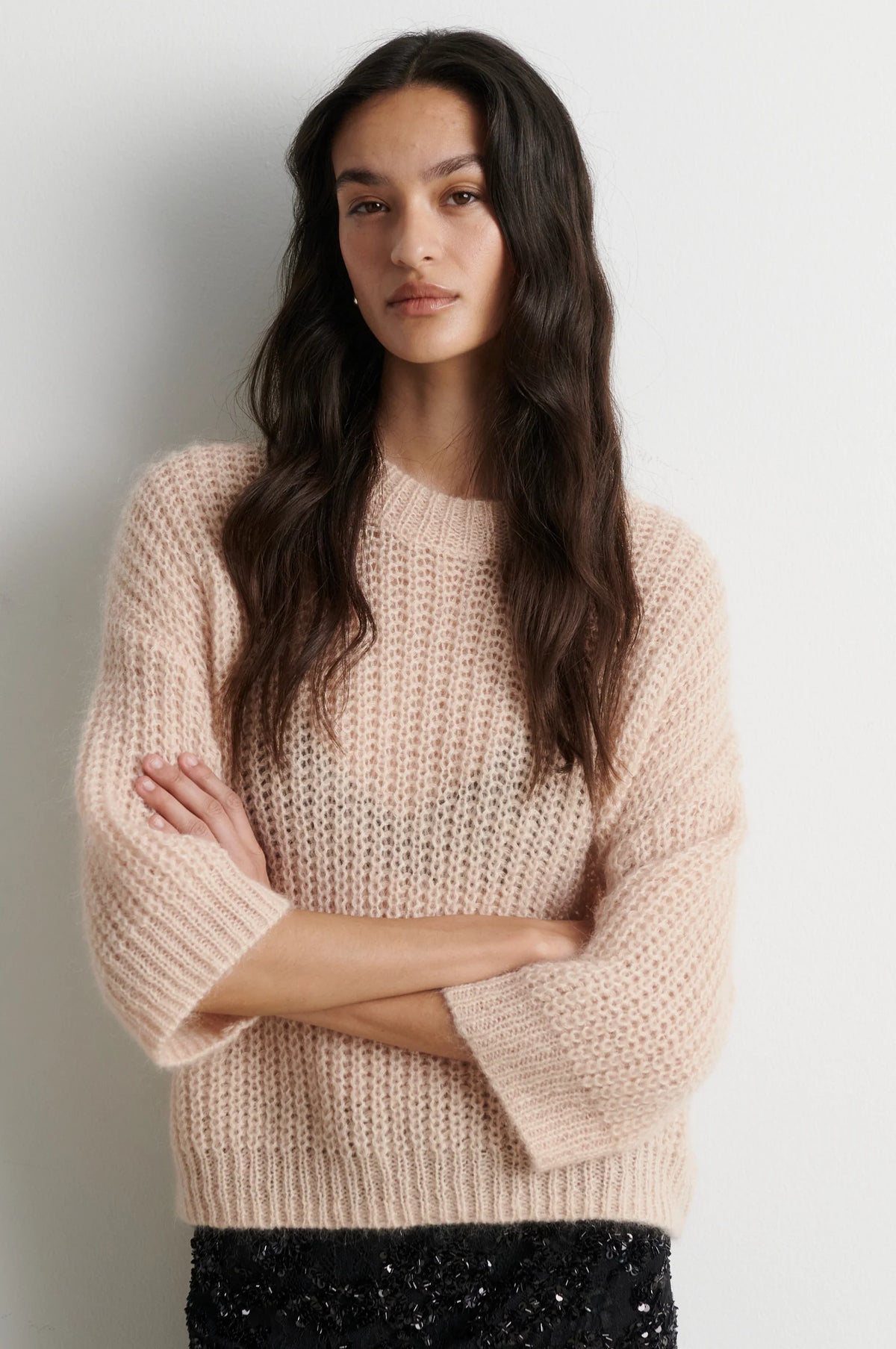 Shortr sleeve knit worn with sequin skirt
