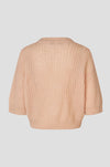 Rear view of short sleeve open weave pale pink knit